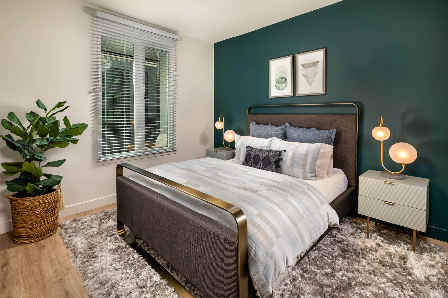 DTLA Apartments - Spacious Master Bedroom With Beautiful Hardwood Floors, Gorgeous Forrest Green Accent Wall, and Window With View