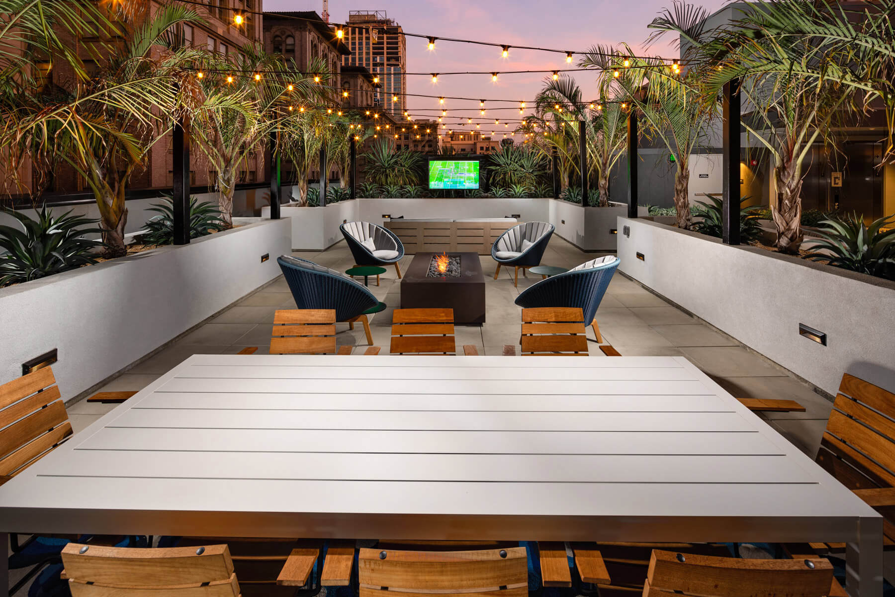 Apartments in DTLA - Trademark Residences - Rooftoop Lounge Area with Comfortable Seating and Fire Pit Feature